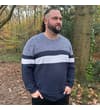 Thumbnail Model wearing navy colour block knitted sweatshirt outdoors.